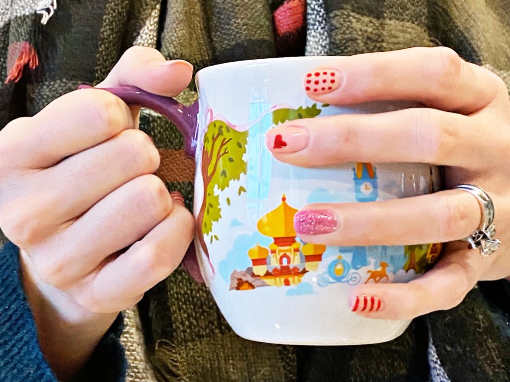 photo of hands holding mug