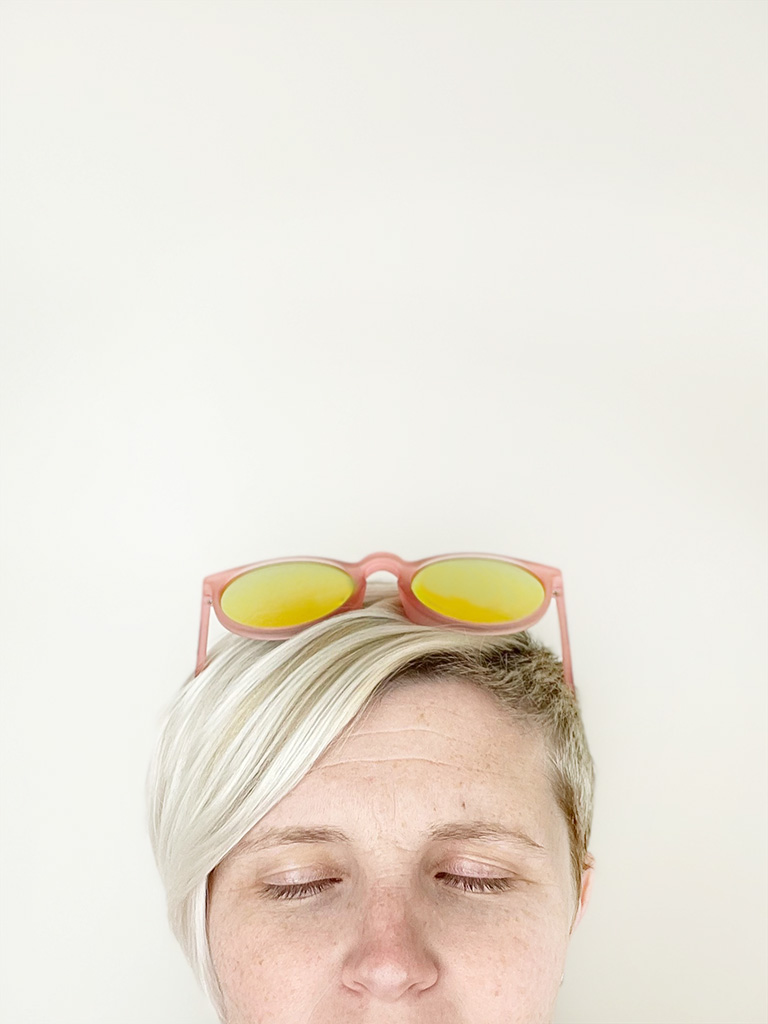 Author's head from nose up wearing sunglasses on top of head